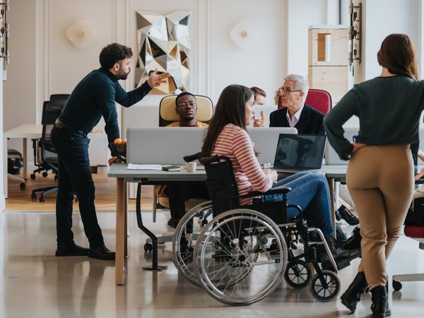 Inclusive office environment showing a diverse team during a business meeting.